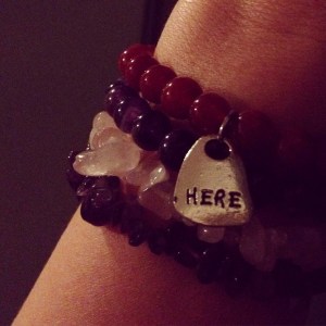 My hand is on our front door.